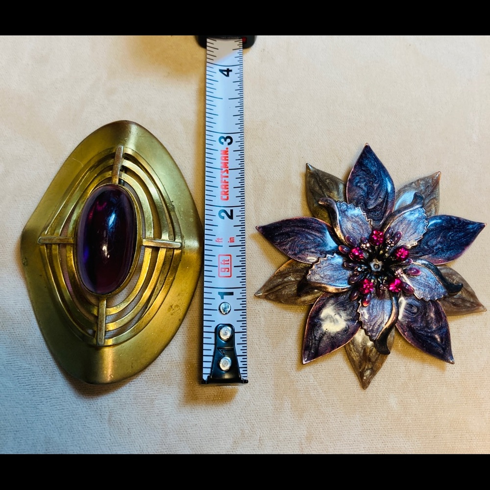 One vintage one slightly newer pin.